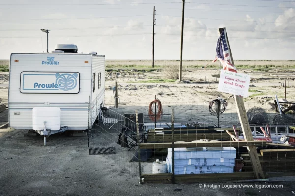 American flag standing by a camper at Holly Beach in Louisiana after hurricane Catarina washed the town away