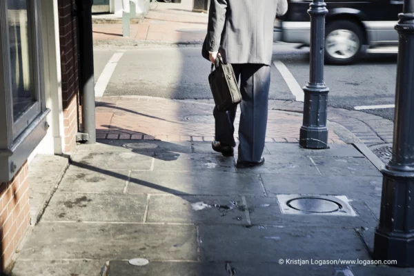 Man with a Briefcase walking on a sidewalk in Louisiana