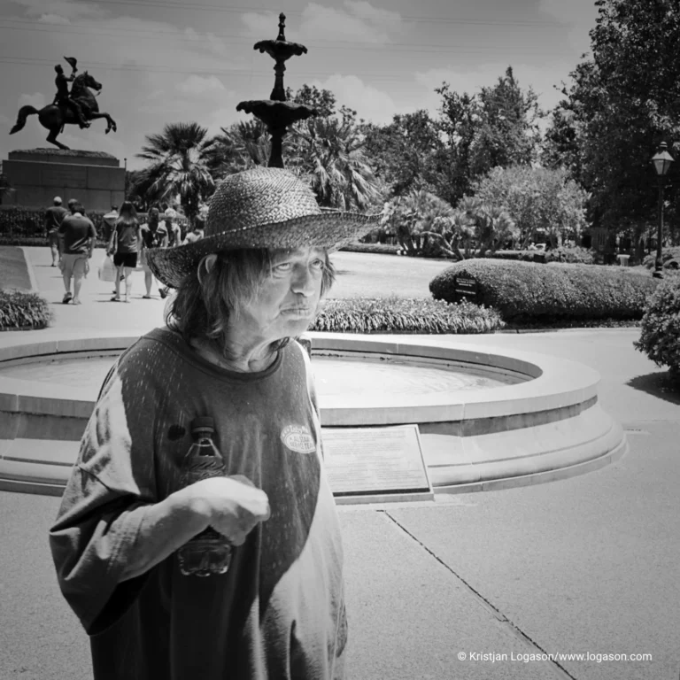 Woman with bottle in hand in a park in New Orleans, Louisiana