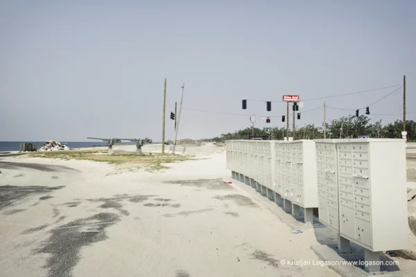 Postboxes and canons at a white sand beach in Long Beach, Louisiana