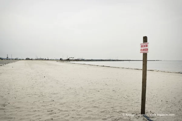 Empty closed white sand beach at Long Beach, Louisiana