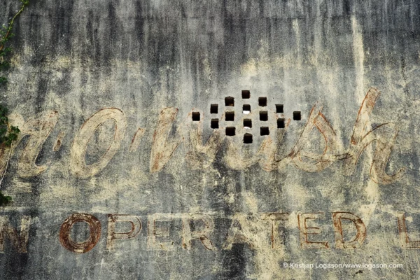 Washed out advertising on a concrete wall in Apalachicola, Florida