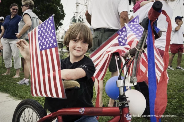 Proud boy with american flag on 4th of july in Apalachicola, Florida 2006