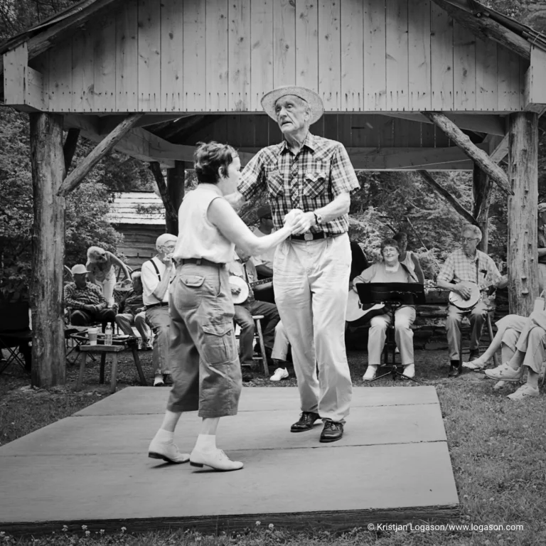 People listening to mountain music and watching traditional folk dances at Mabry Mill Virginia