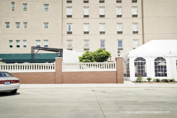 Tent and a car part in front of a condo in Parkersburg